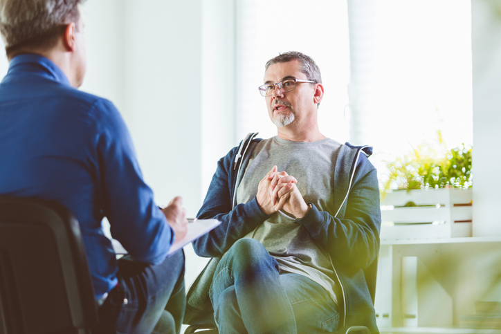 patient speaking with a mental health specialist during a consultation